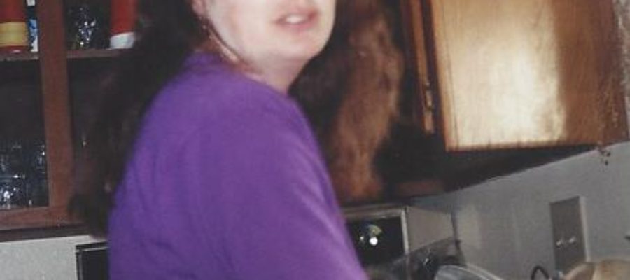 Stressed woman washing dishes